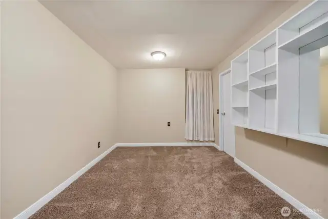 Downstairs bonus room/den could be used as additional living space, storage, craft room or home office.