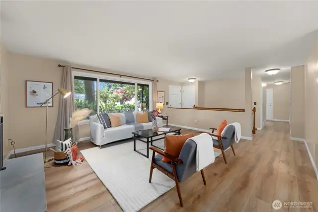From the front door you flow directly into a large and bright living room with LVP flooring and large picture windows to the front landscaping.