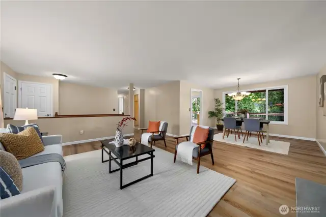 The dining room also has large picture windows that look out onto your massive upper deck and the greenbelt beyond.