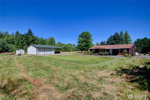 Immaculate home and detached garage/shop on 5 lovely acres