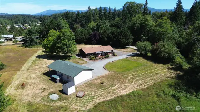 Pride in ownership is obvious in this immaculate home, shop and 5 acre parcel. This is a true gem.