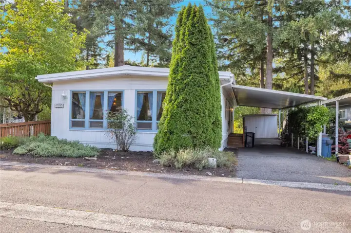 Extra wide carport and guest parking is conveniently just a few feet away.