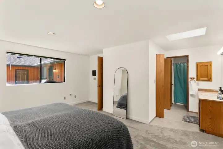Primary features ensuite with walk in closet and full bathroom