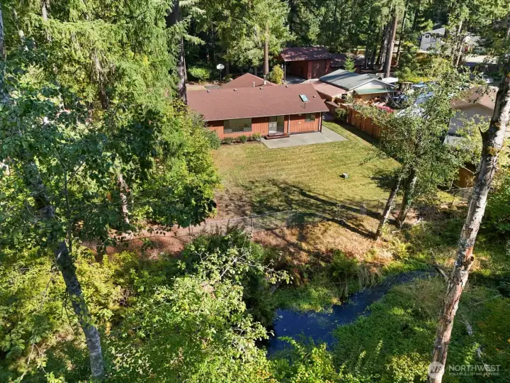 Home sits on just under 1 acre and backs up to Rock Creek