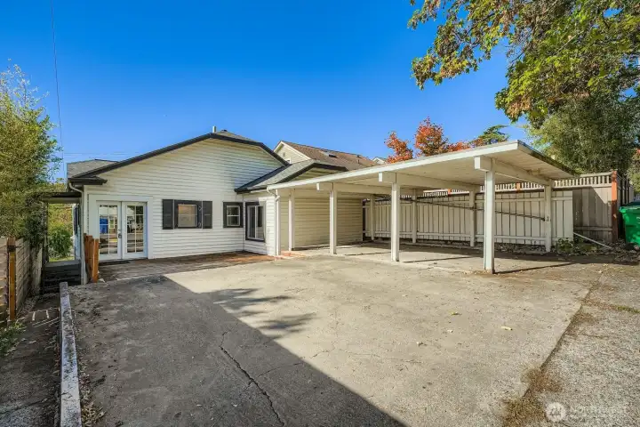 Parking for up to 3 cars w/1 covered space under carport