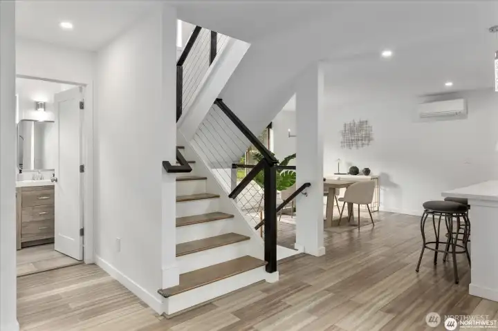 Custom railings accentuate the stairwell.
