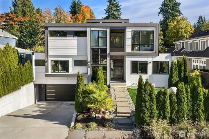 Experience modern style with upscale luxury in this better than new, beautiful Clyde Hill home designed by Medici Architects.