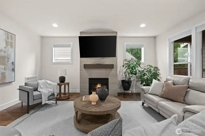 Relax and cozy up in this conversational living room with it's own gas powered fireplace.