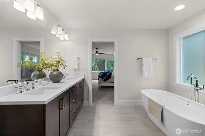 Walking through that sliding barn door, welcome yourself to a beautiful dual vanity and full bathroom.