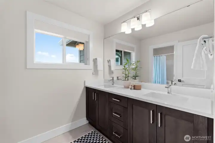 Second and third bedroom share this gorgeous dual vanity bathroom.