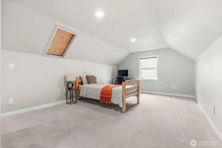 Primary bedroom - wood in ceiling is seal skylight that can be put back in