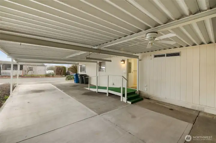 Covered carport featuring ramp access for easy entry into the home.