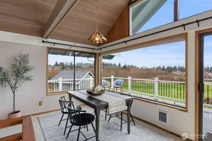 Dining area looking onto HUGE wrap around view deck!