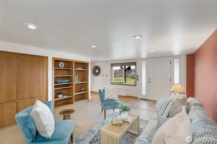 Another shot of lower level living space with built-ins and additional private entrance.