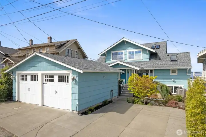 Double car garage with solar panels for EV charging.