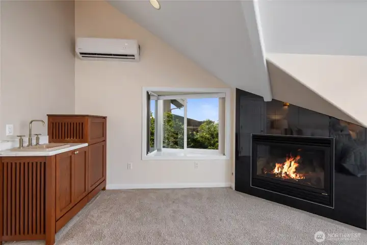 Primary with a fireplace & bar/sink.