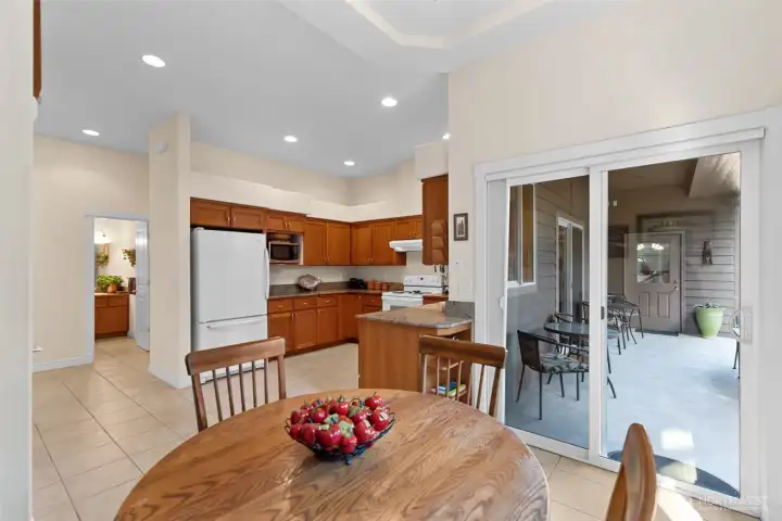 Kitchen w/ Breakfast Nook and Slider Out to Covered Patio