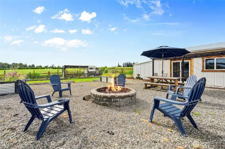 firepit area with adjacent entertainment barn