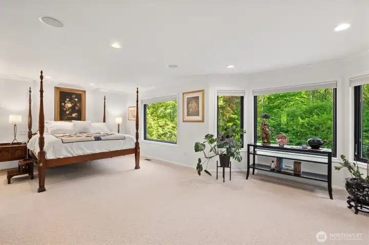 Sprawling primary suite with beautiful windows.