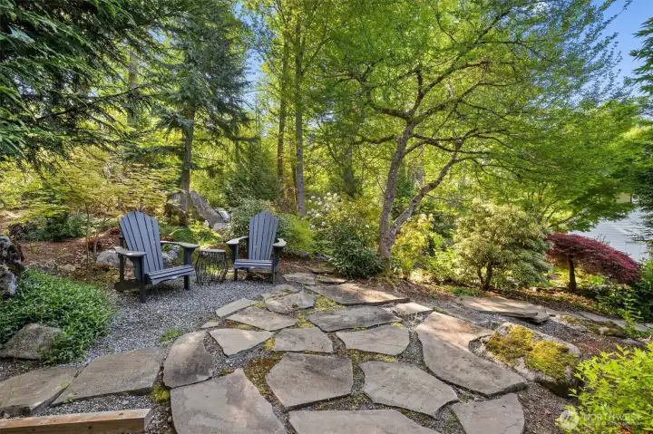 The owners are master gardeners and have transformed this property into a dream-like space. They've planted 55 native trees and plants, enhanced soil quality, built dry creeks for drainage, and more!