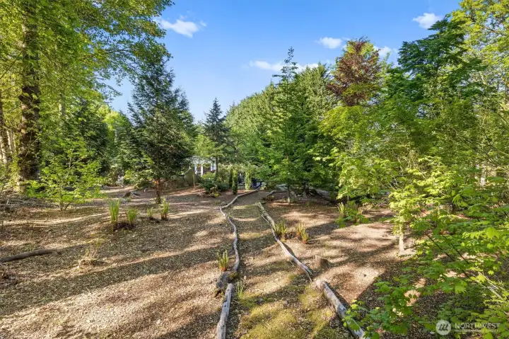 Winding nature trail through back acreage you could get lost in.