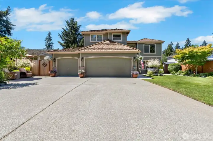 Welcome home to Springwood Estates! Exceptional curb appeal, mature landscaping, and a gated community create a memorable first impression.