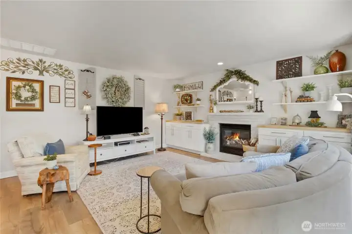 The heart of the home—whether you're hosting friends or enjoying a quiet evening at home, this bright and spacious living room offers comfort, connection, and beautiful views of the backyard oasis.