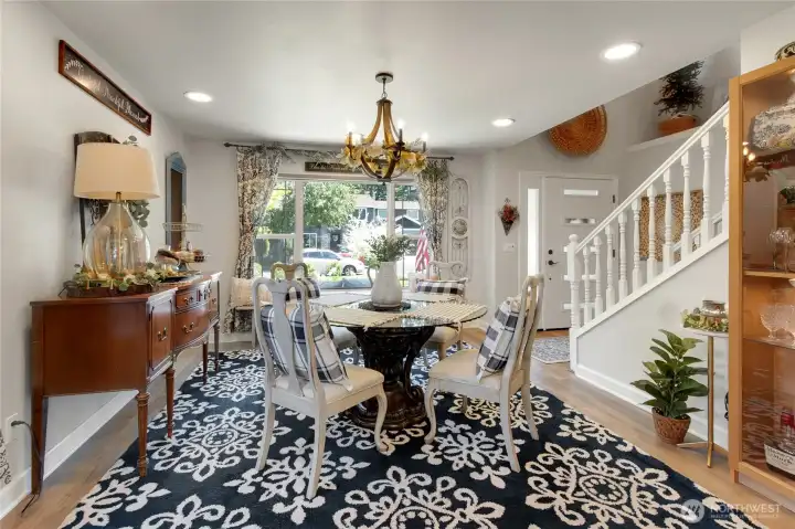 Designed for memorable meals and meaningful conversations, the spacious dining room offers plenty of room to gather while enjoying natural light and beautiful views of the landscaped front yard.