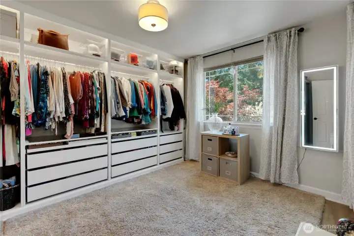 Currently styled as a boutique-inspired dressing room with custom organization systems, this flexible space can easily function as a traditional bedroom, office, or hobby room.