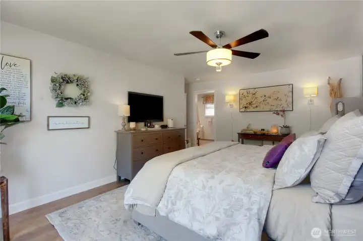 Generous proportions provide ample room for larger furnishings while maintaining an open, comfortable layout that flows seamlessly into the private ensuite bath.