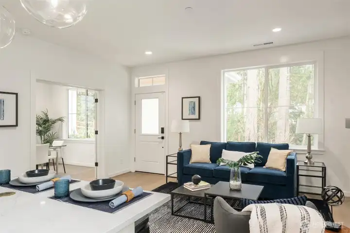 Generous windows draw natural sunlight throughout the home