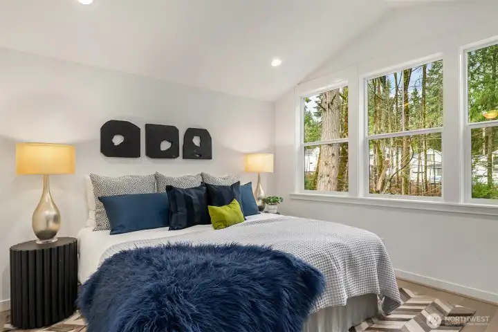 Second floor primary suite w/vaulted ceilings