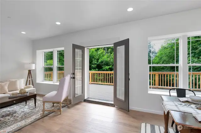 French Doors open to large deck for entertaining