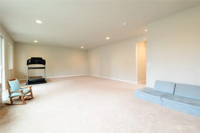 The daylight basement enjoys tall ceilings and large windows to bring in lots of natural light.