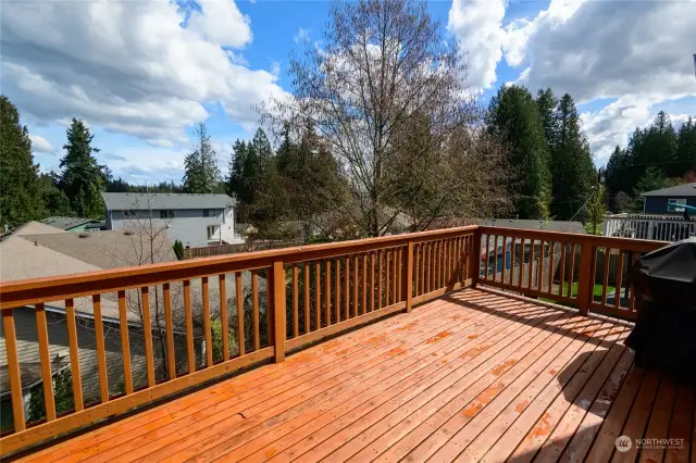The spacious raised back deck enjoys beautiful sunrise views and even peek-a-boo mountain views on clear days.
