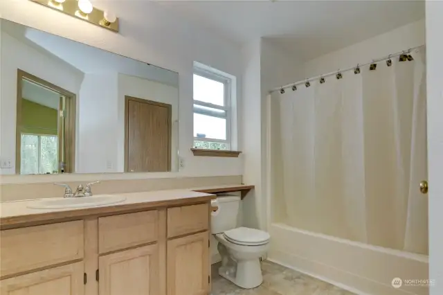 Completing the primary suite is this full bathroom with an abundance of counter top space!