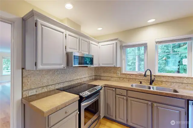 Kitchen appointed with stainless appliances.