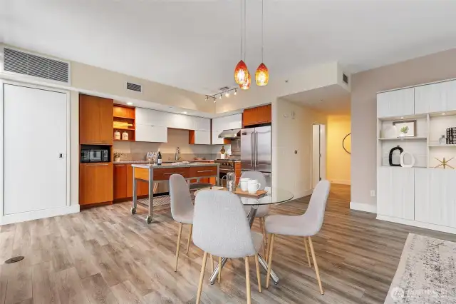 Well appointed kitchen with high end appliances, island, & dining room