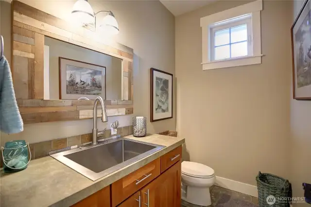 The half bath adjacent to the Mudroom and the Craft/Laundry room. Note the handy extra large sink.