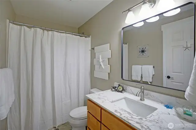 1 of the 2 full baths on the ground level.
