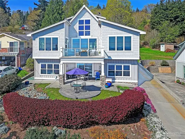 Street side elevation and lovely grounds which include wisteria, raspberries and lots of nice ornamentals.