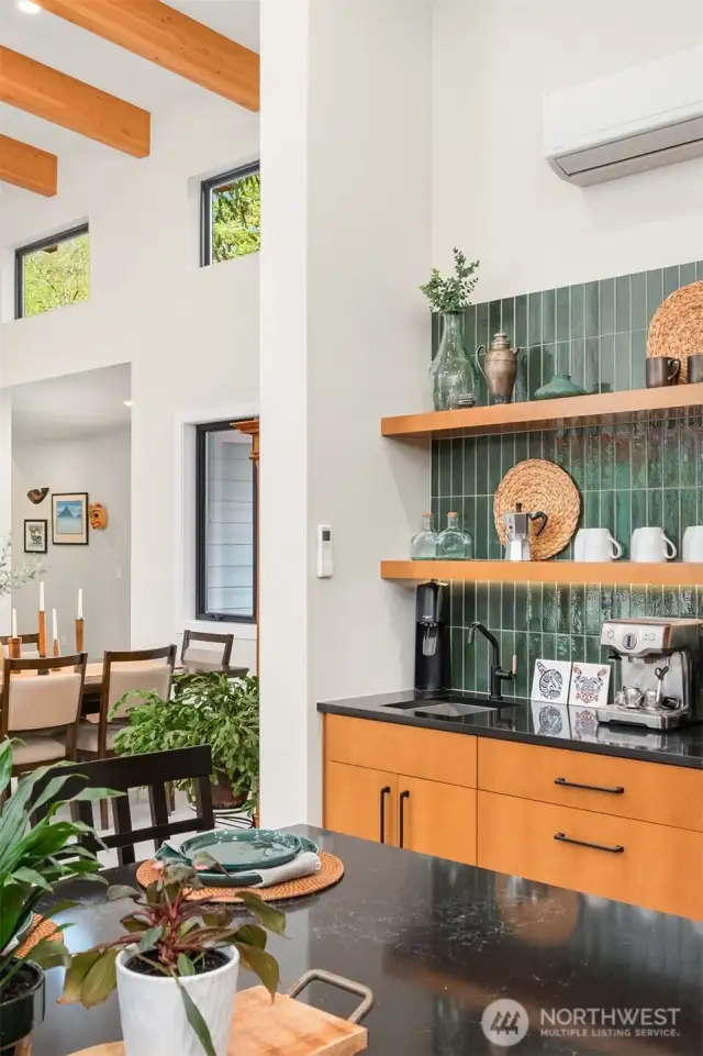 Coffee Bar with floating shelves, sink with filtration system, and gorgeous tile backsplash...start your day here!