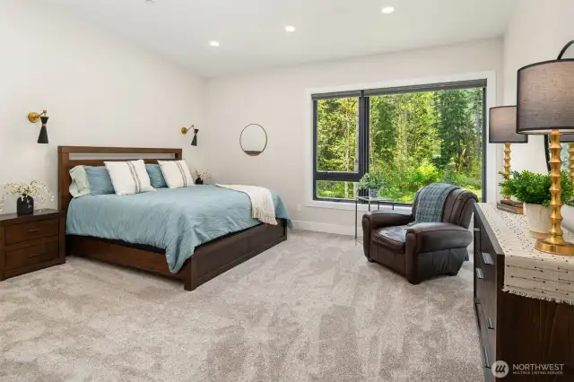 This thoughfully designed floor plan offers a private and spacious owner's suite on one end of the home with all other bedroom suites on the opposite end of this expansive rambler. The bedroom flooring is high-end plush carpet and your toes will tell the difference!