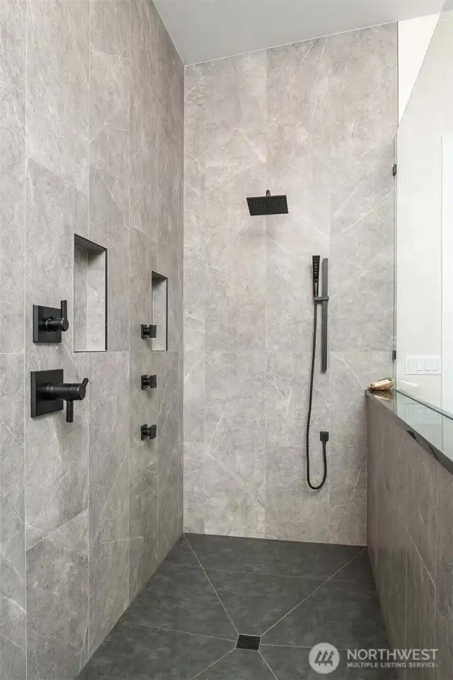 Large walk-in shower with several jets, rain showerhead and wand, plus easy-access valves for "wet-free" operation!