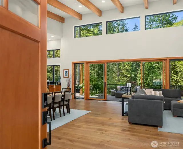 Enter to soaring, open-beam ceilings and walls of windows for sun-filled spaces. Grand open-concept floorplan designed to let the outdoors in! The view from every window overlooks the scenic setting and sky.