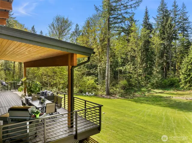 The home sited on a level and gently sloped forested 4.53 acres with a fish bearing stream about midway. There is a perfect amount of open space for sun and light to envelope the house.