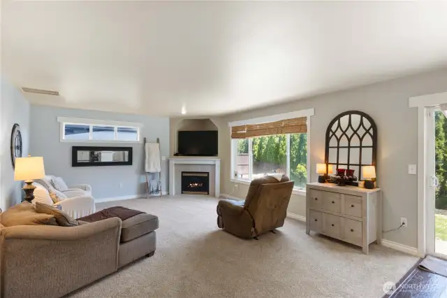 Family Room with gas fireplace also has new carpet!