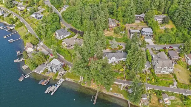 Another view of the waterfront and home is in the trees.