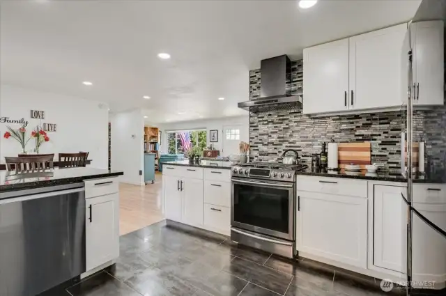 Tiled back splash, beautiful stainless steel appliances