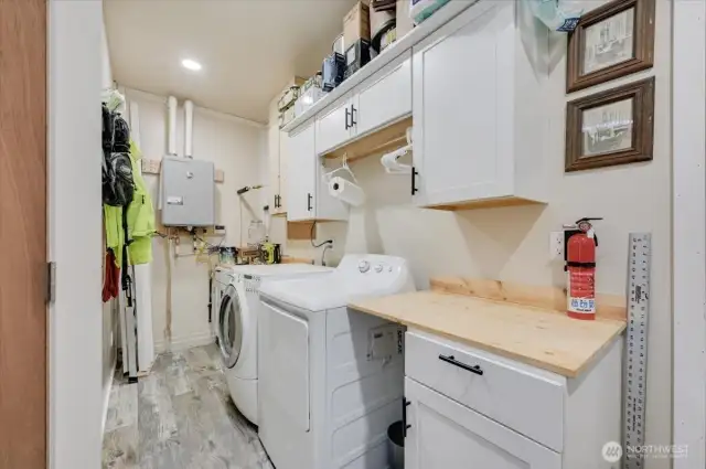 Utility room.  Tankless water heater.